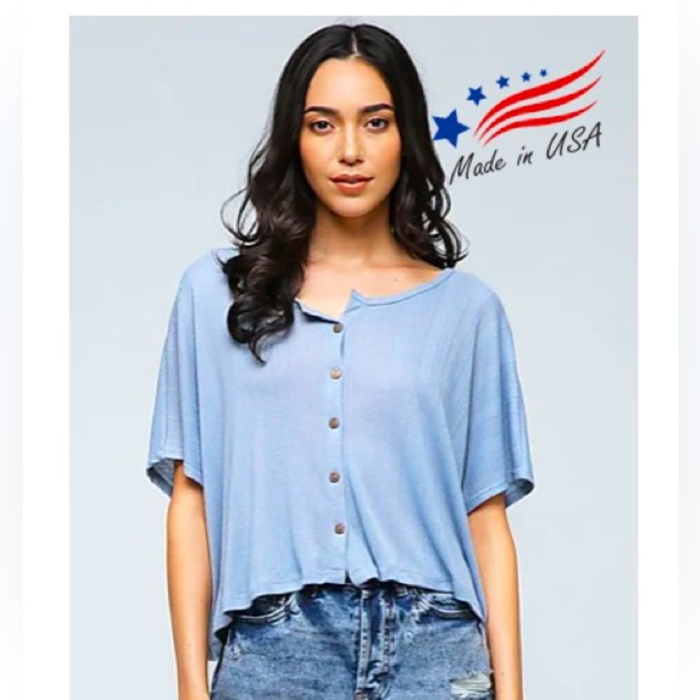 Women’s T-shirt with buttons up front. Nice light blue color.